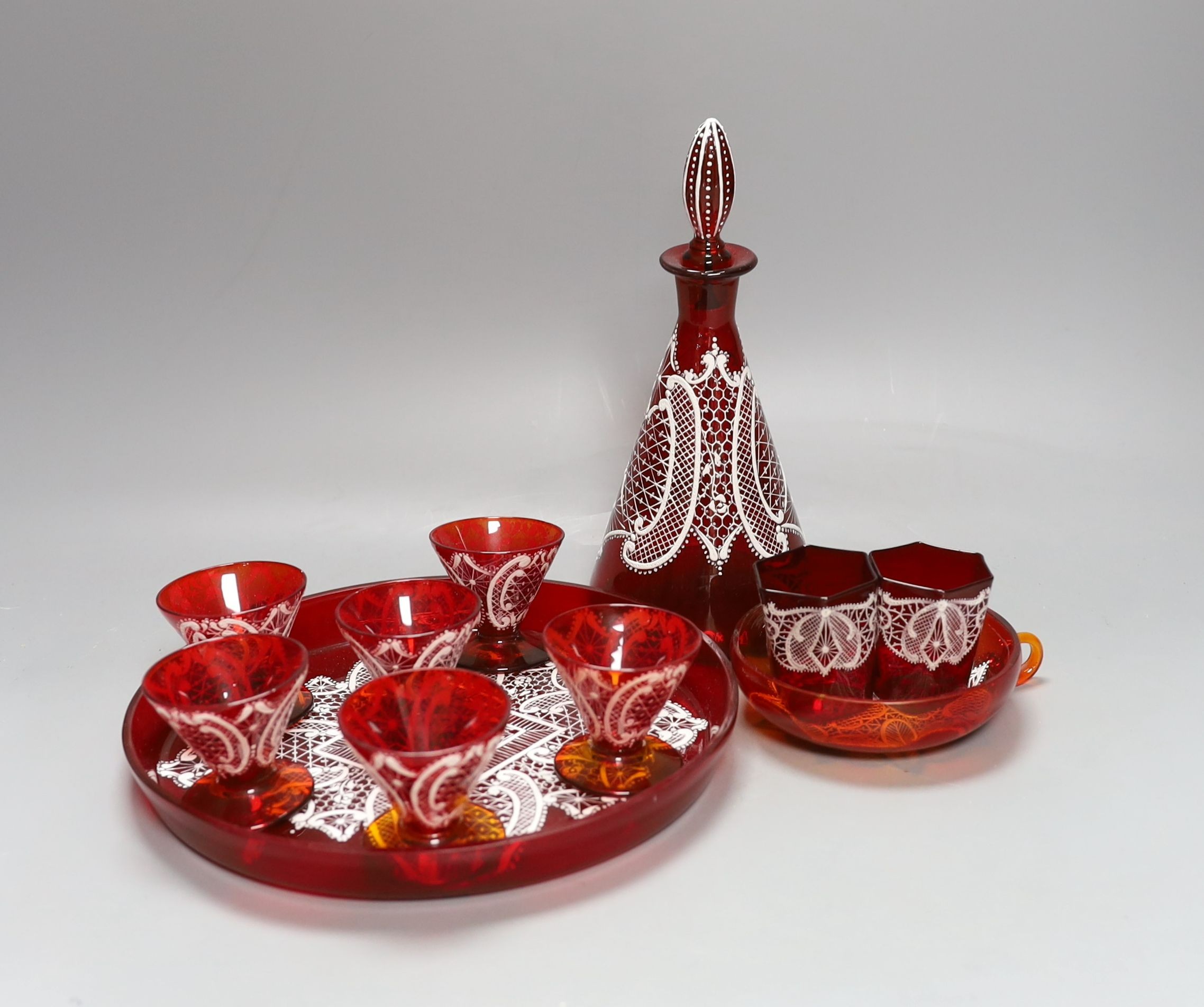 A Venetian red enamelled glass lace-pattern liqueur set